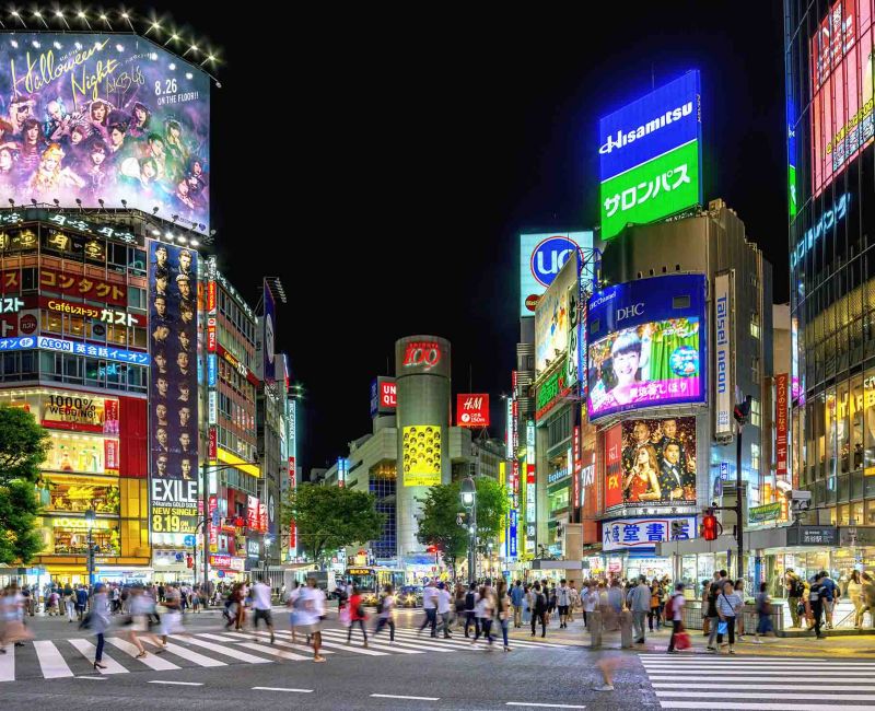Busy Shibuya crossing in Tokyo stock photo at night